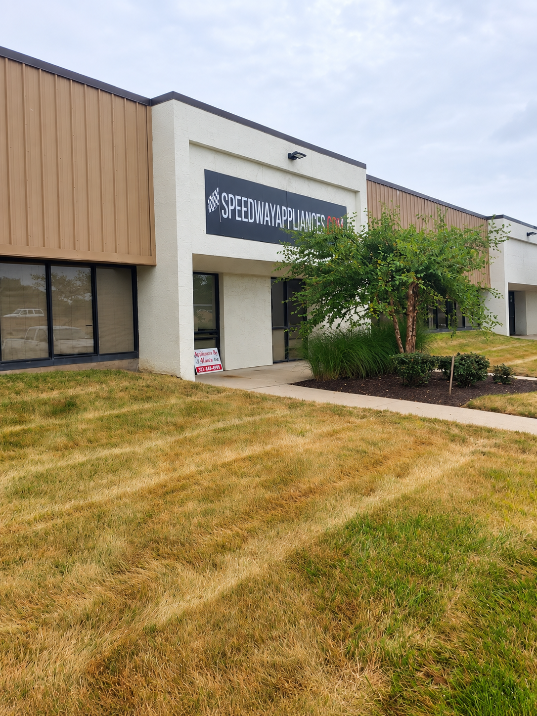 Former Speedway Appliances storefront with the business sign above the entrance
